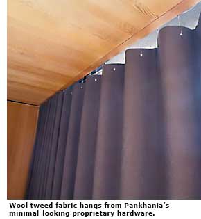 Wool tweed fabric hangs from Pankhania’s minimal-looking proprietary hardware. 