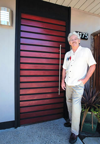Eichler owner Kevin Pyne stands alongside the custom door he designed and built himself. 