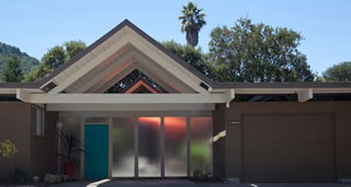 Two Marin County installations by Northgate Garage Doors illustrate how traditional roll-up garage doors can dovetail well with the Eichler aesthetic when they are re-faced with Eichler siding. Note the visible horizontal lines on each example, a minor drawback. 