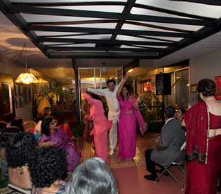 Dancers at Prabha’s bollywood bash revel to the band Geetanjali, which performs in the room adjacent to their atrium here.