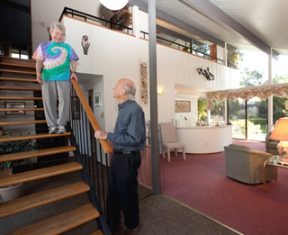 Phil and Sue Fialer at the staircase to the second-floor balcony of their Palo Alto two-story.