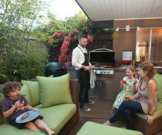 Sunnyvale Eichler owner Peter Ford, above with wife Tera and children Tobin and Emma, at their outdoor kitchen.