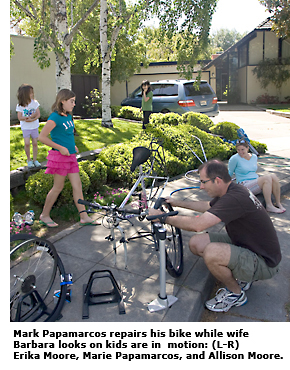 primewood dad fixing bike with kids and wife