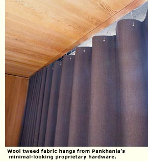Wool tweed fabric hangs from Pankhania’s minimal-looking proprietary hardware.