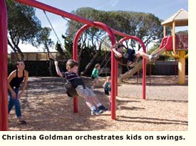 residents on swings in park